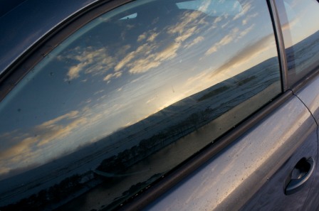 A quick shot of the landscape's reflection in my car window.