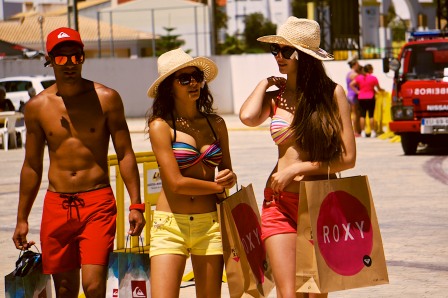 Some young models promoting Roxy take a stroll, with price labels still attached to everything.